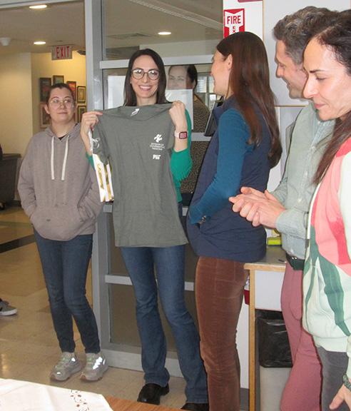 Former Postdoctoral Associate receiving her official MIT T-shirt